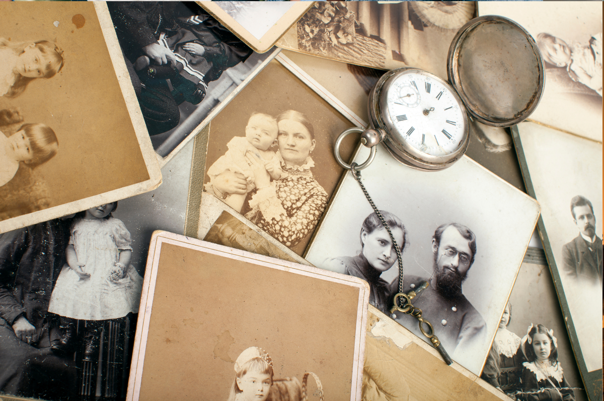 A collection of treasured historical family photographs and a pocket watch.